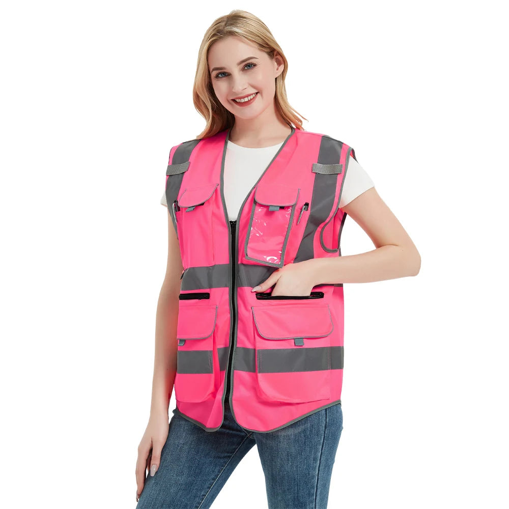 High visibility pink safety vest with reflective tape for women, ideal for construction and emergency work.
