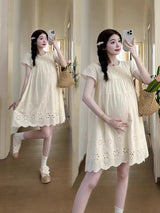 A-line cotton maternity dress in natural color, featuring boat neck and knee-length design, perfect for summer wear.