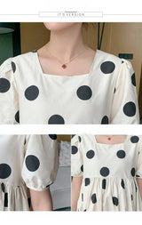Close-up of a Polka Dot Loose Maternity Dress featuring a square neckline and short puff sleeves, perfect for summer.