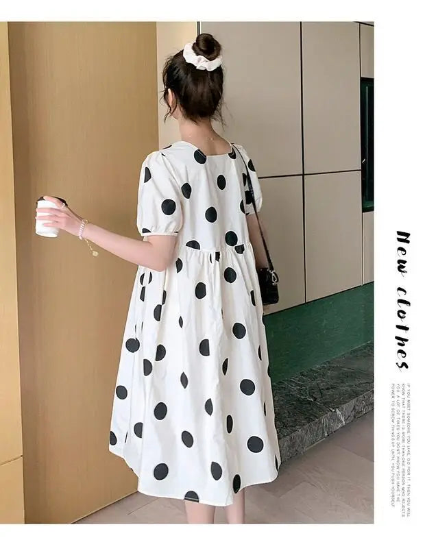 Polka dot loose maternity dress by YIGUDAR, featuring short sleeves and a mid-calf length, perfect for summer.