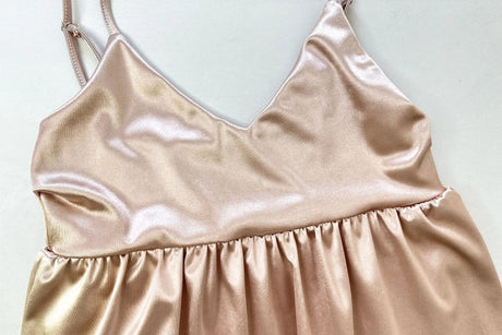 Ruffle strap V-neck backless crop top in soft peach satin fabric, perfect for summer outings and club wear.
