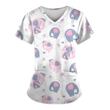 Cute elephant print scrub top for women, perfect for veterinary nurses and medical professionals.
