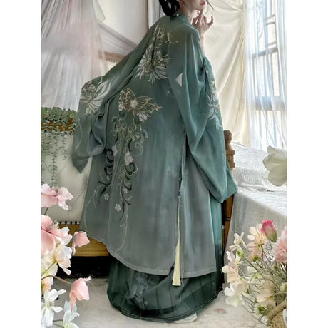 Back view of a woman wearing a Song Dynasty Hanfu set featuring elegant floral embroidery in chiffon fabric.
