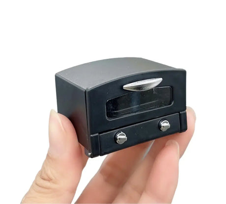 Miniature black vintage dresser prop for newborn baby photography, perfect for creative baby photoshoots.