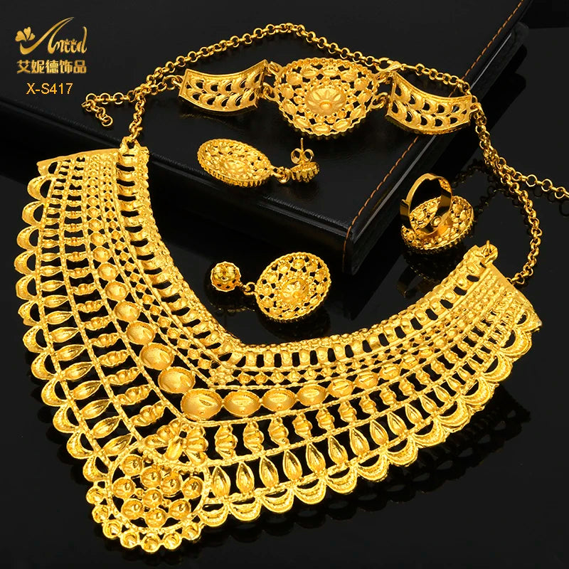 Luxury Indian bridal jewelry set featuring 24K gold plated necklace, earrings, ring, and bracelet for women.