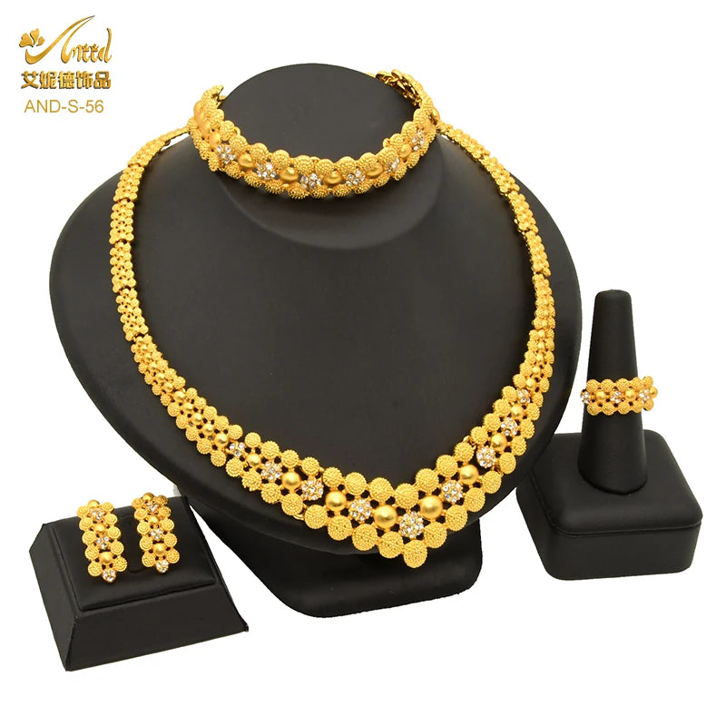 Luxury Indian bridal jewelry necklace set featuring 24K gold plating, includes necklace, earrings, bracelet, and ring.