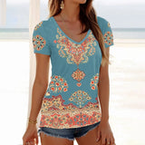 Women wearing a vintage floral 3D print V-neck t-shirt with vibrant colors and patterns at the beach.