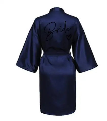 Navy satin team bride robe with short sleeves and stylish script design, perfect for bridal parties.