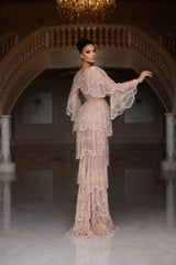 Elegant Arabic nude stone wedding gown with tiered sleeves, featuring intricate beading and a floor-length silhouette.