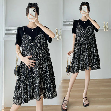 Elegant black floral maternity dress with layered ruffles, perfect for summer baby showers.