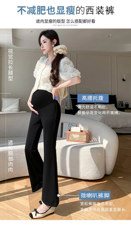 Stylish pregnant woman wearing Y2K bootcut maternity pants, showcasing chic summer fashion in black and cream.