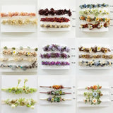 Variety of adjustable faux flower headbands for newborn photography, featuring multiple colors and designs, suitable for baby girls.