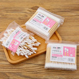 100pcs Baby Cotton Swabs in bags, wooden stick, soft cotton tips, ideal for infants and kids personal care.