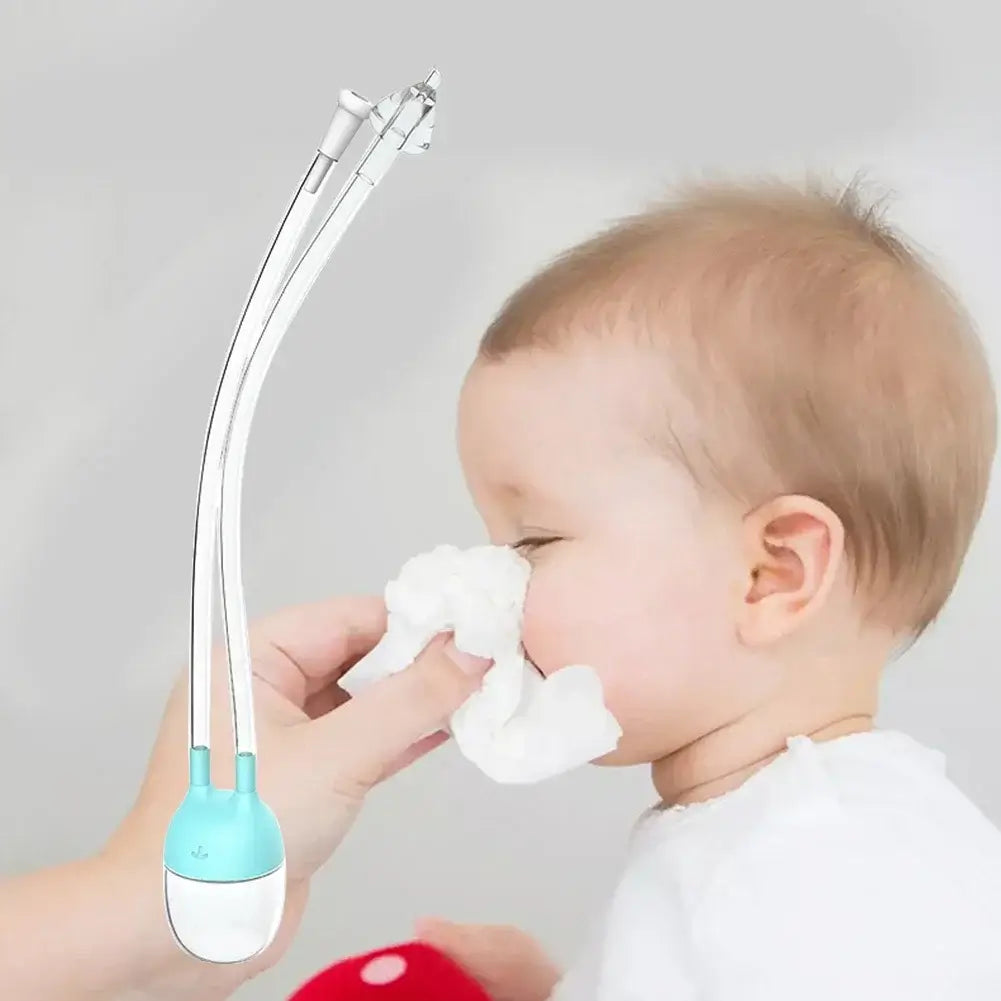 Baby nose cleaner tool in use, gently removing mucus from baby's nose with a soft tissue.