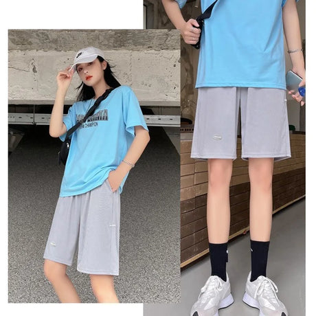 Casual outfit featuring a blue t-shirt and gray shorts, perfect for summer wear and active lifestyle.