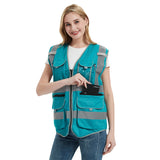 Smiling woman wearing a turquoise safety vest with reflective tape, showcasing a multipocket design for work and outdoor activities.