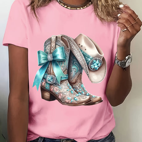 Pink t-shirt featuring stylish cowboy boots and a hat with embellishments and a turquoise ribbon.