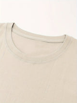 Close-up of a beige crew neck on a retro country music festival t-shirt made from 100% cotton.