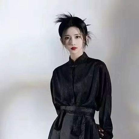 Woman wearing a traditional black Hanfu outfit with elegant styling, showcasing cultural fashion and beauty.